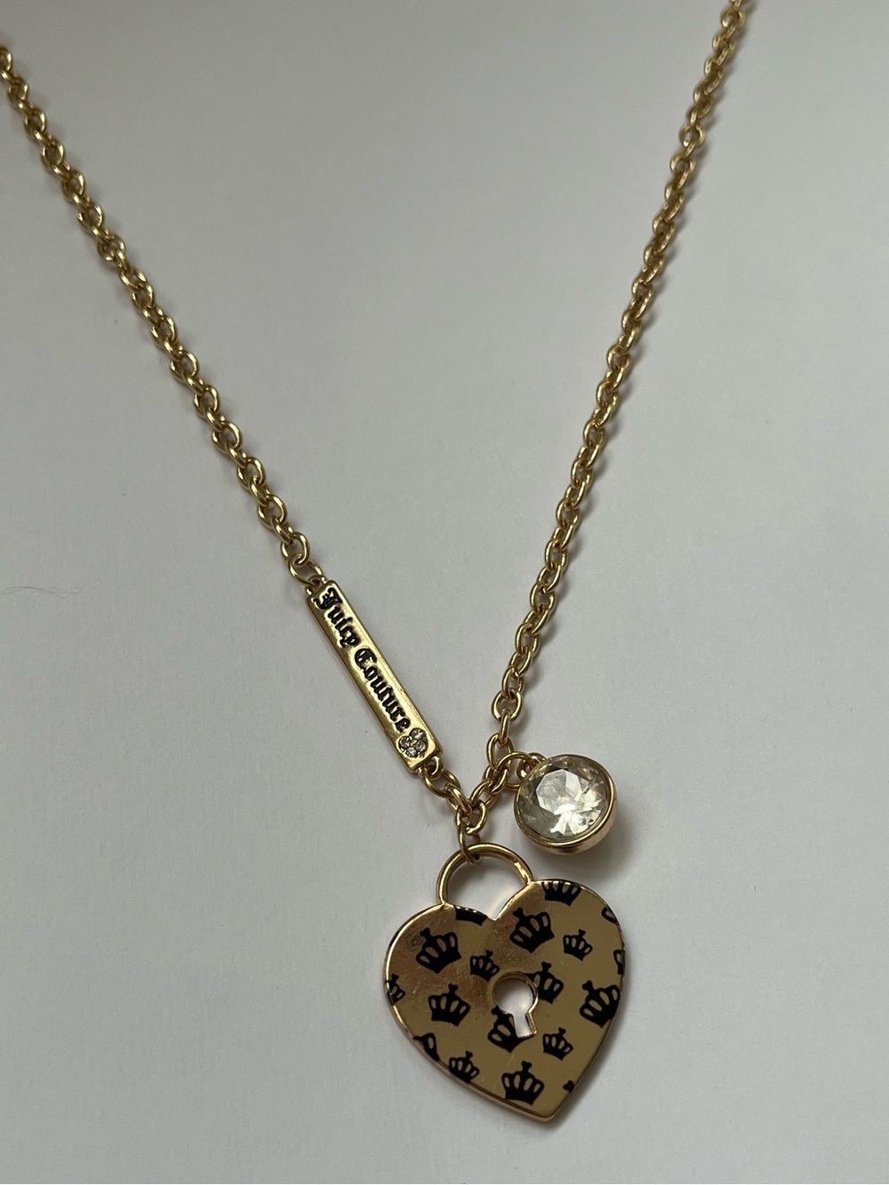 Vintage-style Juicy Couture gold heart necklace with a leopard print design